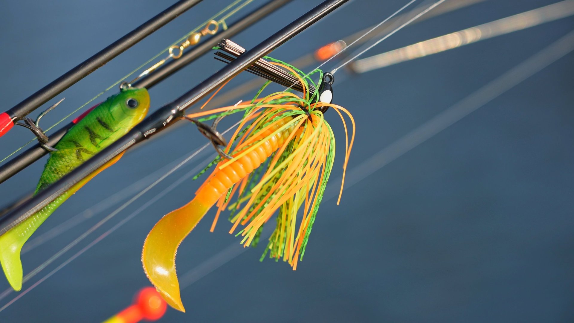 Fishing rods on pier at sunset